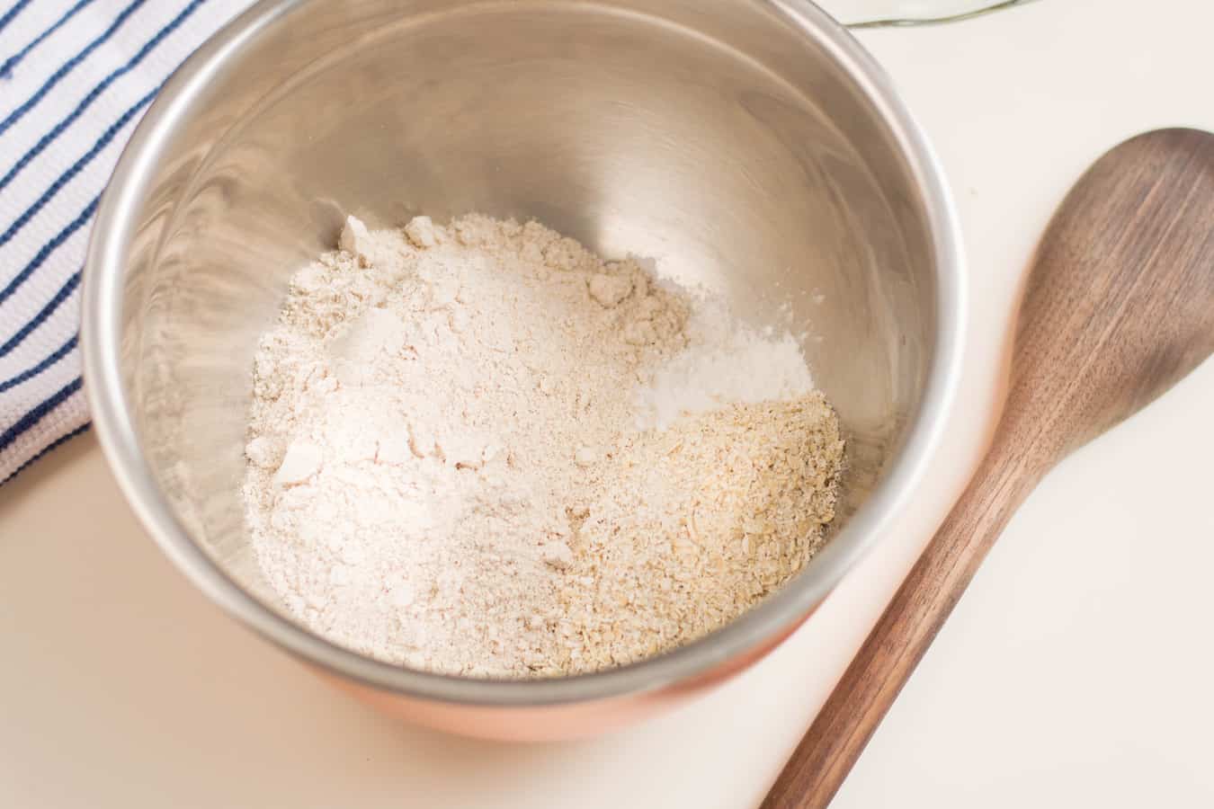 spelt pie crust dry ingredients in a silver bowl
