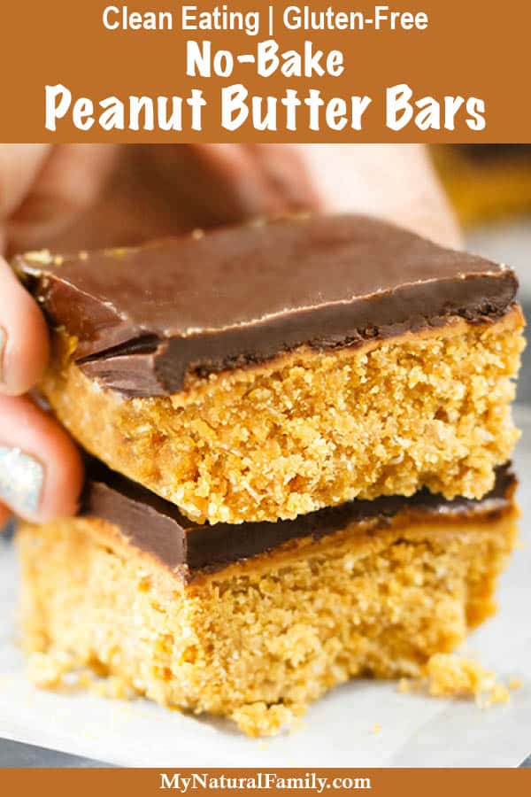 Woman picking up healthy peanut butter bars by hand