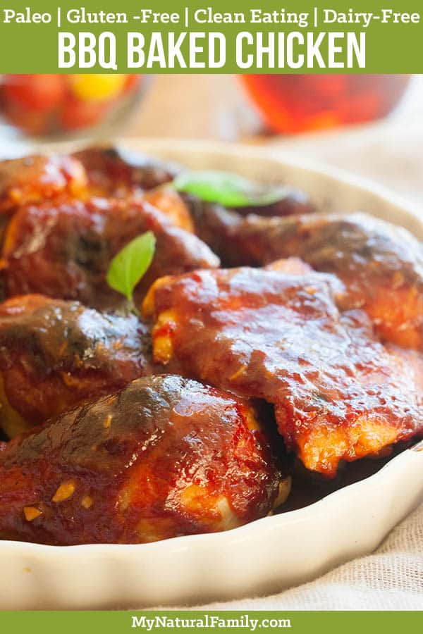 Baked chicken thighs with a homemade BBQ sauce on top in a white pan