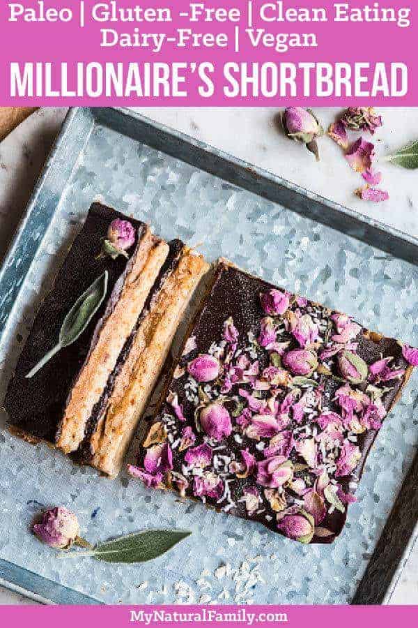 These Paleo millionaire's shortbread bars have a shortbread base, topped with a caramel layer and then a layer of dark chocolate then sprinkled with rosebuds for a special treat! {Paleo Gluten-Free, Clean Eating, Dairy-Free, Vegan} #paleo #paleorecipes #mynaturalfamily