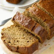 healthy banana bread with applesauce on a cutting board