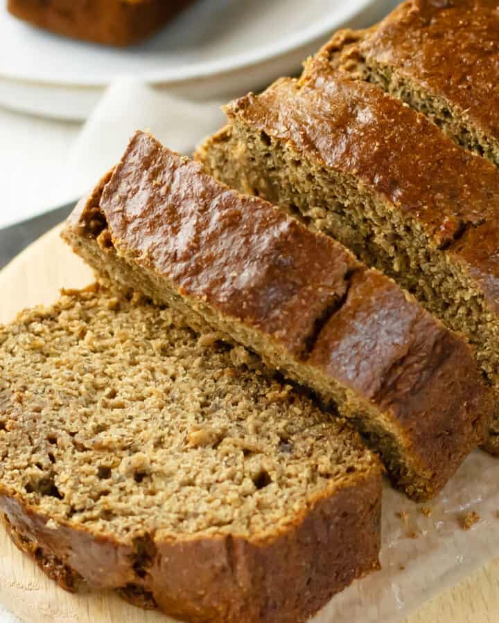 healthy banana bread with applesauce on a cutting board