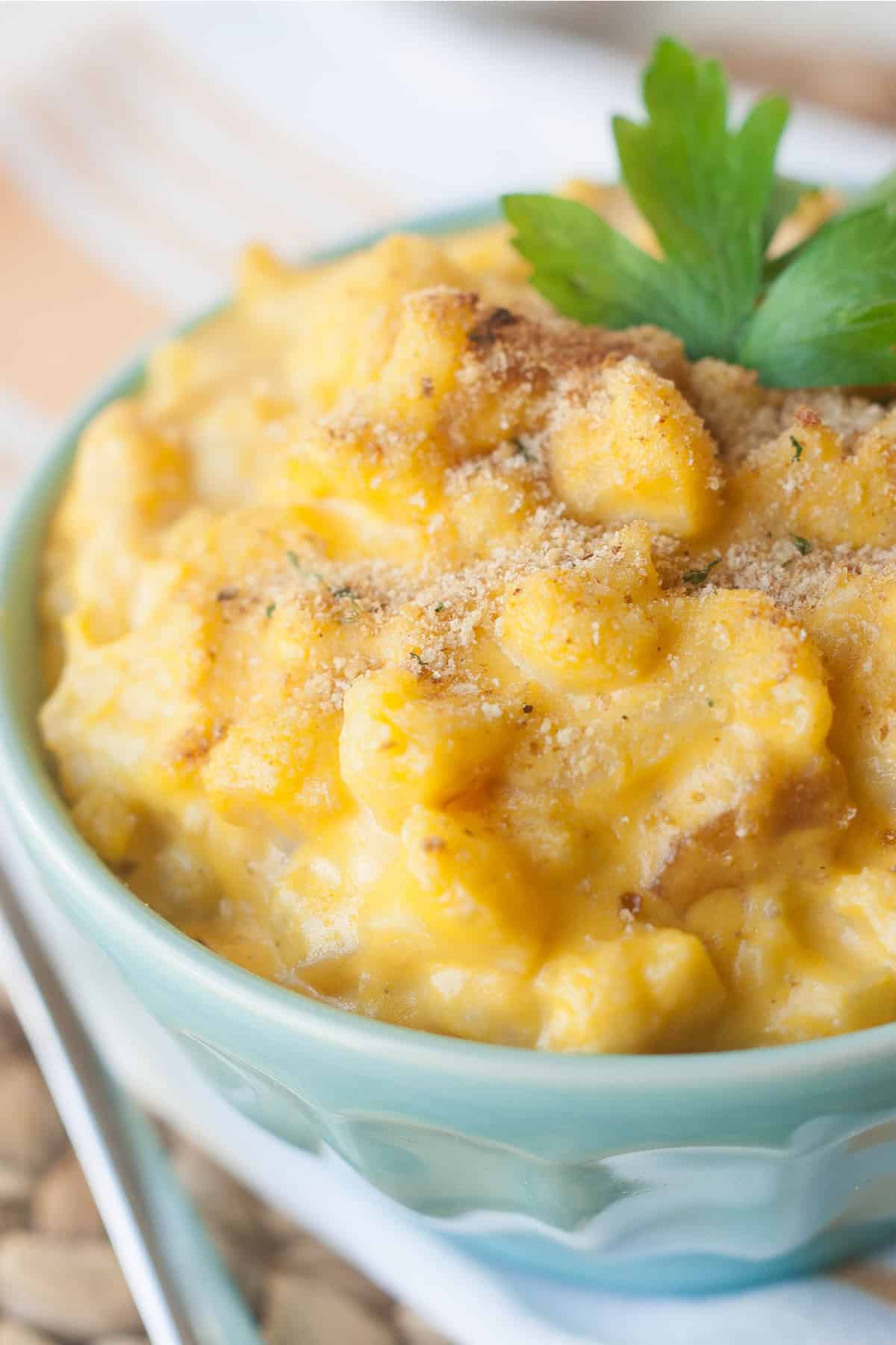Coconut milk mac and cheese in a turquoise bowl